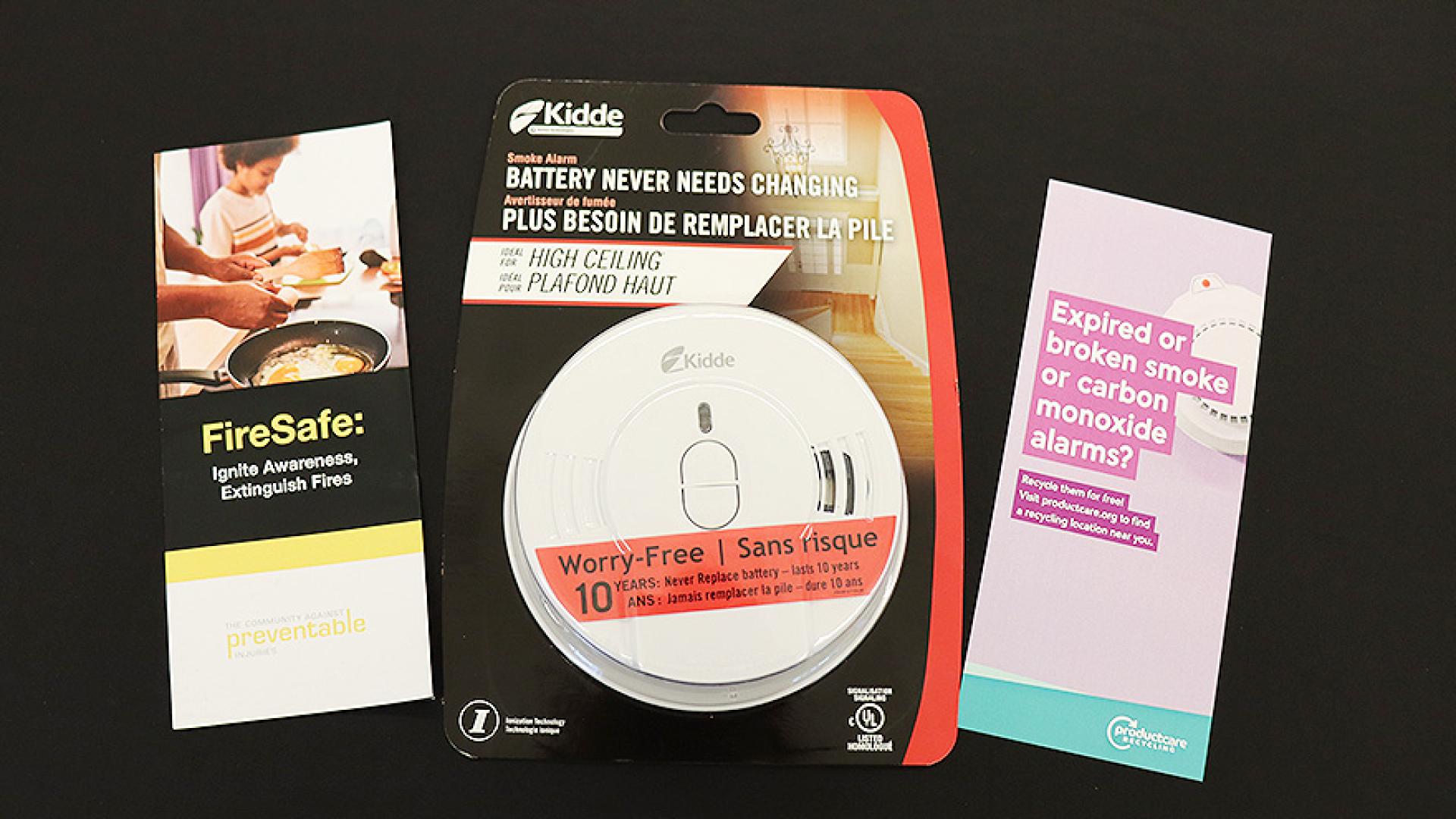 Package of a smoke alarm and educational brochures